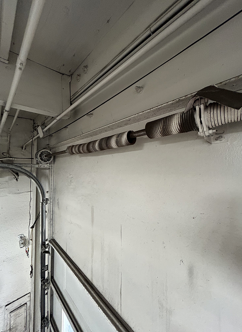 fix garage door broken spring in orange county